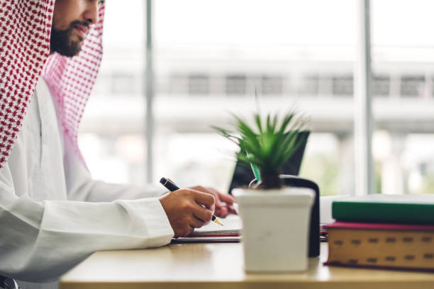 Arabic businessman working with laptop computer.creative arab business people planning at modern work loft